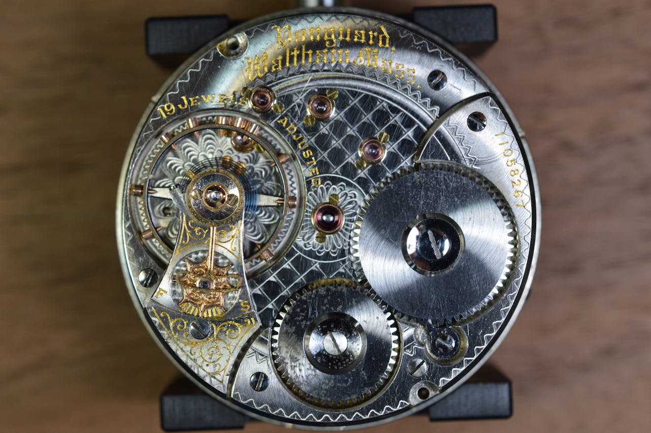 Close-up of an antique clock mechanism showcasing gears and intricate details.